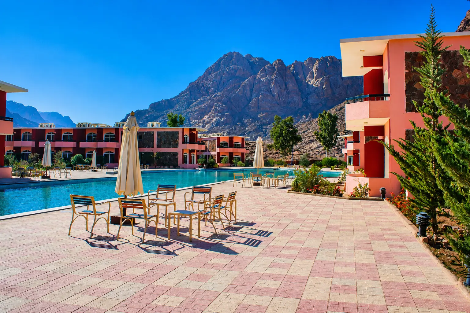 Poolside terrace with shaded seating facing the Sinai peaks