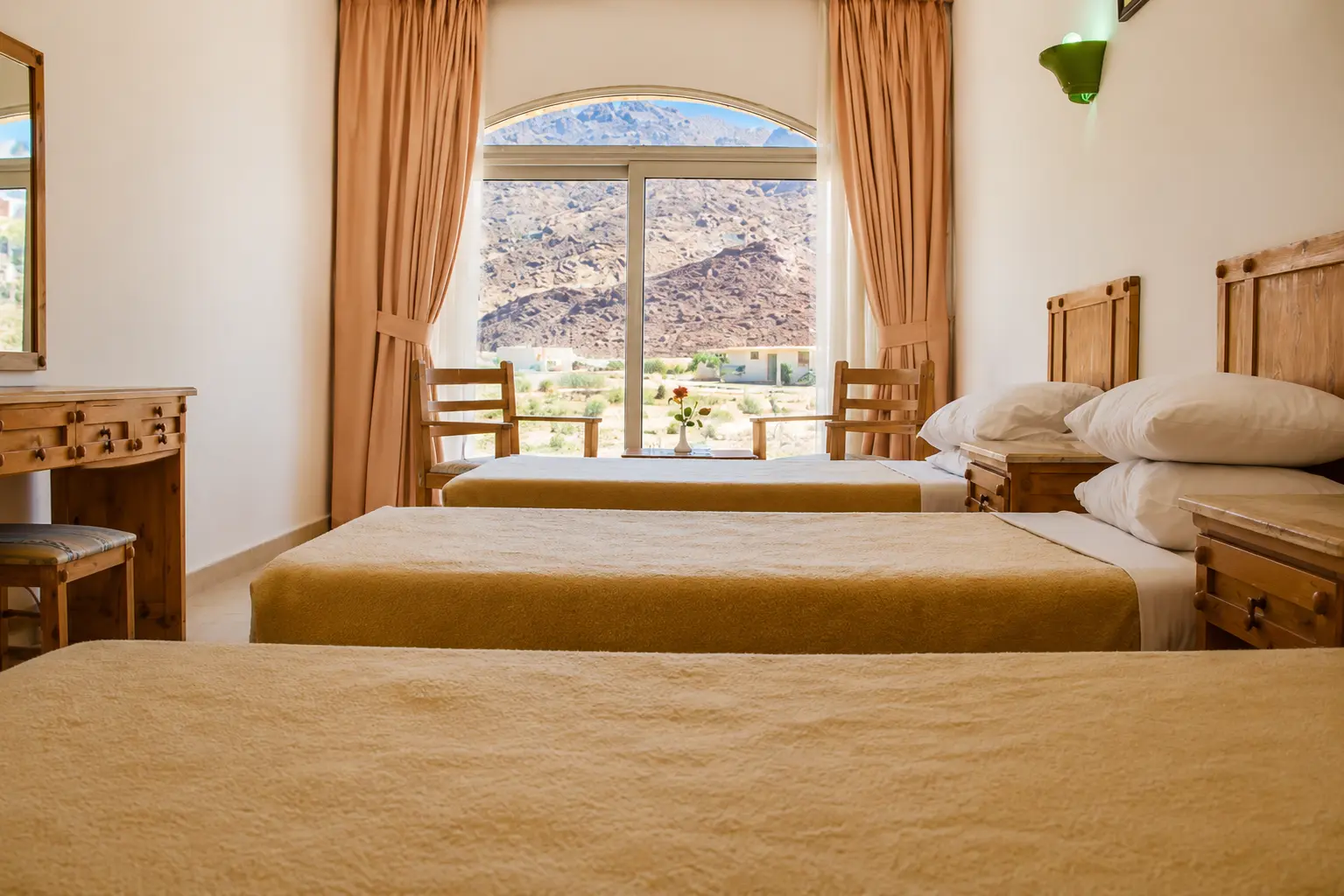 Family room with three beds facing the Sinai mountains